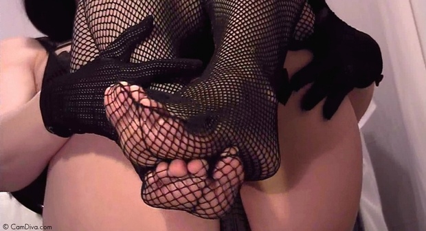 Delicious looking fishnet stockings toes peeking through.; Lingerie 