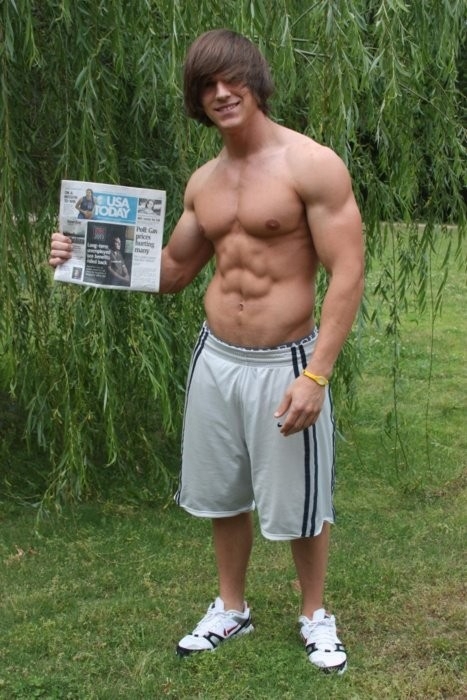 Was this shirtless hunk kidnapped? Is he holding up the paper to prove that he is still alive on that date? I would have been more likely to pay the ransom if he had tugged his shorts a little lower.; Men 